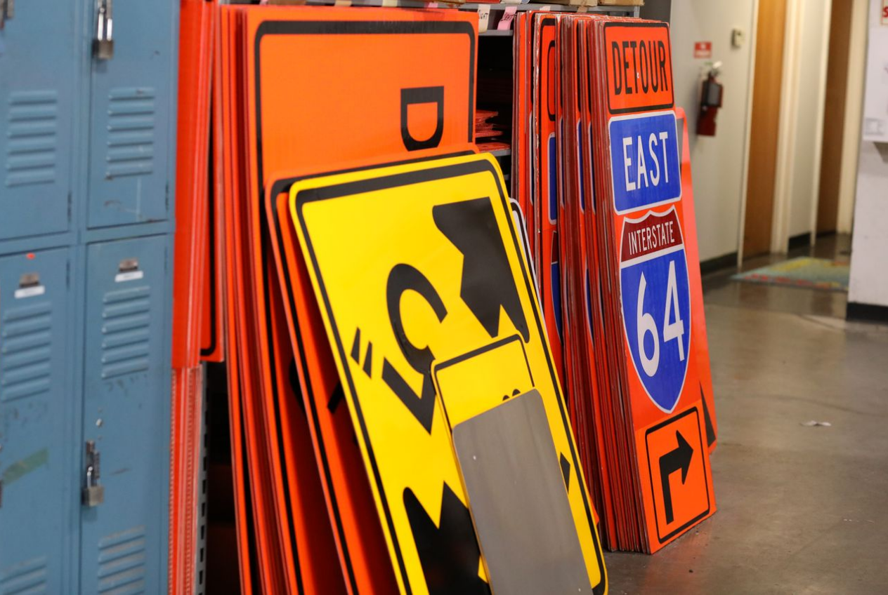 traffic signs for rent or buy, stacked in storage at Spivey Services